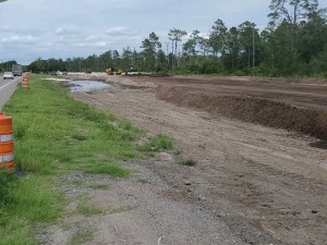 Spreading material for new roadway base (June 2021 photo)