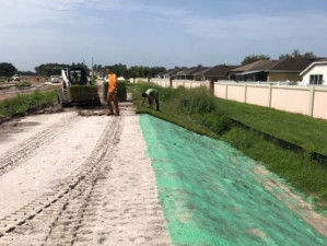 Installing erosion mat and sod along the new roadway construction (July 29, 2020 photo)
