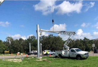 Installing mast arms for new traffic signals in the southeast corner of US 41 and Ayers Road (July 15, 2020 photo)