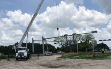 Installing mast arms for new traffic signals in the southwest corner of US 41 and Ayers Road (July 15, 2020 photo)