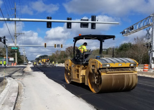 Paving the reconstructed intersection of Sam Allen Road and Buchman Highway in preparation to reopen the roadways in January 2020