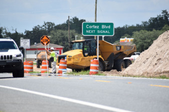 Workers control traffic for equipment crossings on US 301 south of SR 50 (7/17/2020 photo)