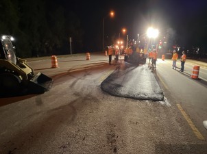 Placing temporary asphalt for traffic shift (4-21-2023 photo)