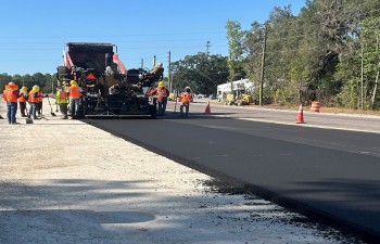 Placing temporary asphalt for a traffic shift (April 2023 photo)
