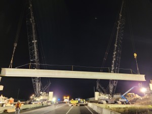 The first beam is ready to place for the Overpass Road bridge over northbound I-75 (10/16/2021 photo)