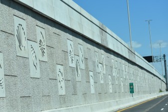 Decorative aquatic life panels are included along the wall next to 118th Ave. N (3-22-2023 photo)