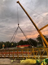 A crane prepares to lift truss for pedestrian bridge (5-25-2023 photo)