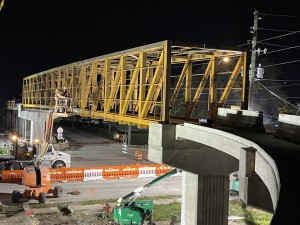 Finishing up the work for the night on the just-placed pedestrian bridge over Cortez Blvd. (5-25-2023 photo)