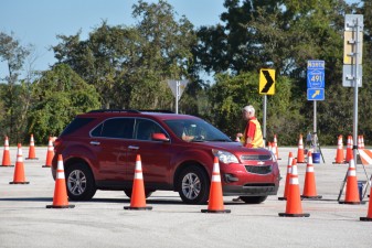 Drivers give feedback about their roundabout test-track experience to an FDOT engineer (10/13/2021 photo)