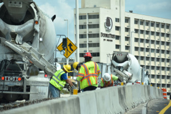 Workers place concrete between the West Shore Boulevard entrance ramp and the northbound I-275 lanes (3/16/20 photo)