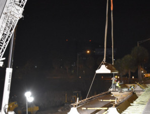 A beam is lowed into place by crane and guided by workers at I-275 over SR 60 (3/21/2020 photo)