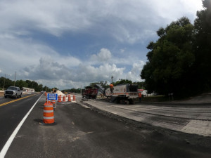 Looking south on US 98, north of Trilby Road. Traffic goes by as the old roadway pavement is removed. (July 2, 2020 photo)