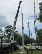 Placing a pole into position (8/17/2022 photo)
