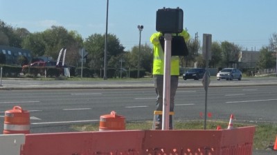 Install pedestrian signal heads (March 2026 photo)