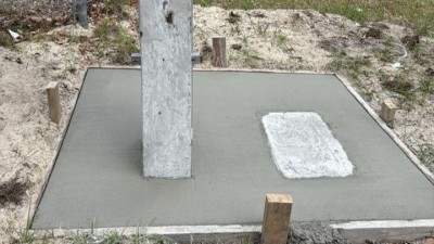 Finished mow pad on SR 574 (W Martin Luther King Jr Boulevard) at N 12th Street (May 2026 photo)