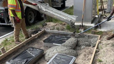 Pouring southwest corner mow pads on SR 574 (W Martin Luther King Jr Boulevard) at N 12th Street (May 2026 photo)