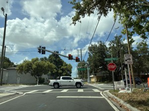 SR 574 (W Martin Luther King Jr Boulevard) signal in flash mode as side streets flash red (June 2026 photo)