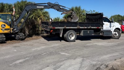Loading & hauling removed asphalt debris (May 2026 photo)