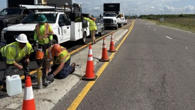 Looking north on Benjamin Road as crews install signage (June 2026 photo)