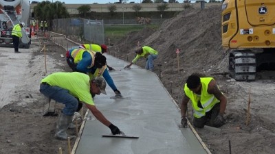 Looking west on Benjamin Road as crews finish concrete (April 2026 photo)