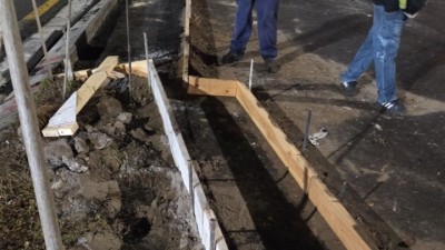 Crews construct curb forms to prepare for concrete (February 2026 photo)