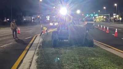 Placing peanut sod in median (April 2026 photo)