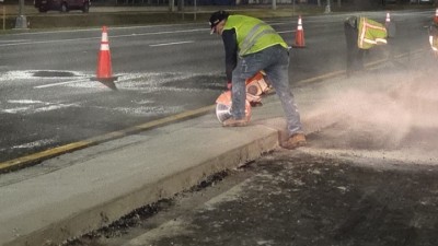 Saw cutting curb on US 19 (February 2026 photo)