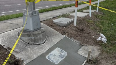 Poured mow pad around the replaced 13x24 pull box (June 2026 photo)