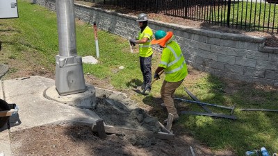Poured mow pad around the replaced pull box (June 2026 photo)