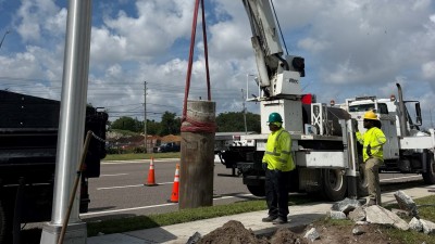 Removing the existing light pole base & mow pad (June 2026 photo)