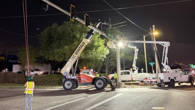 Flying & installing the mast arm at the SW corner (July 2026 photo)