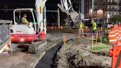 Placing asphalt curb pad at the NE corner (August 2026 photo)