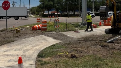 Placing millings over the area of the removed sidewalk (May 2026 photo)
