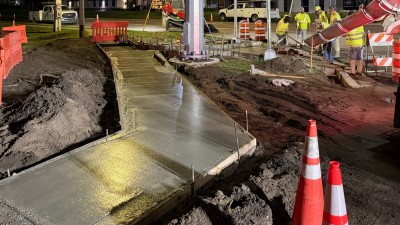 Poured sidewalk at the SW corner (September 2026 photo)