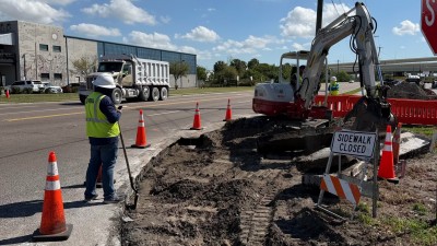 Removing the existing concrete sidewalk (March 2026 photo)