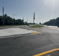 Looking northeast on SR 54 at newly installed traffic separator at Altamont Lane (July 2026 photo)