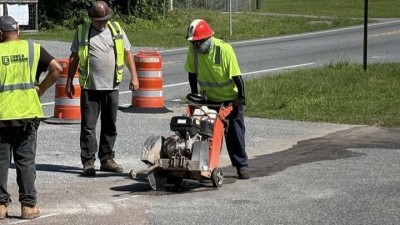 Cutting existing asphalt in median (June 2026 photo)