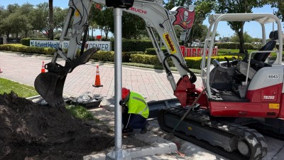 Completed ped pole assembly at the SE corner (August 2026 photo)