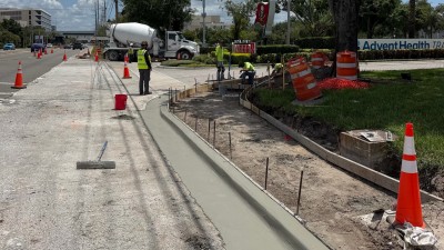 Poured curb and gutter at the SW corner (August 2026 photo)