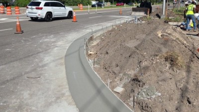 Type F curb finished SE corner (September 2026 photo)