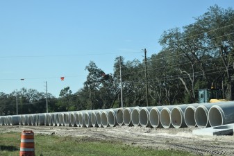 A stockpile of drainage pipe to be installed along SR 52 (11/29/2022 photo)
