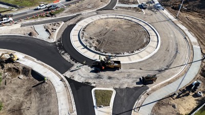 Looking south over 7th Street at crews paving the roundabout at US 98/US 301 (11-12-2025 photo)