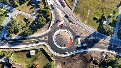 The red concrete placement for the roundabout truck apron is underway (11-13-2025 photo)