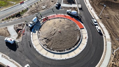 The red concrete placement for the roundabout truck apron is underway (11-13-2025 photo)