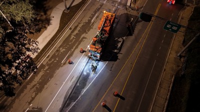 Crews work just past midnight to prepare the roundabout for opening (11-19-2025 photo)