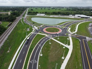 Looking south over the US 98 Bypass at the roundabout at Old Lakeland Highway at final paving and marking (6-1-2026 photo)