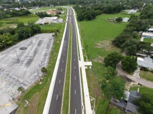 Looking west over the US 98 Bypass toward the roundabout at 7th Street at final paving and marking (6-1-2026 photo)