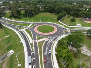 Looking west over the US 98 Bypass at the roundabout at 7th Street at final paving and marking (6-1-2026 photo)