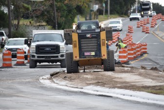 Crews work to finish up the last branches of the roundabout to open all movements (12-9-2025 photo)