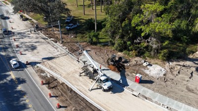 Installing streetlight pole bases on the west side of the new roundabout (11-4-2025 photo)